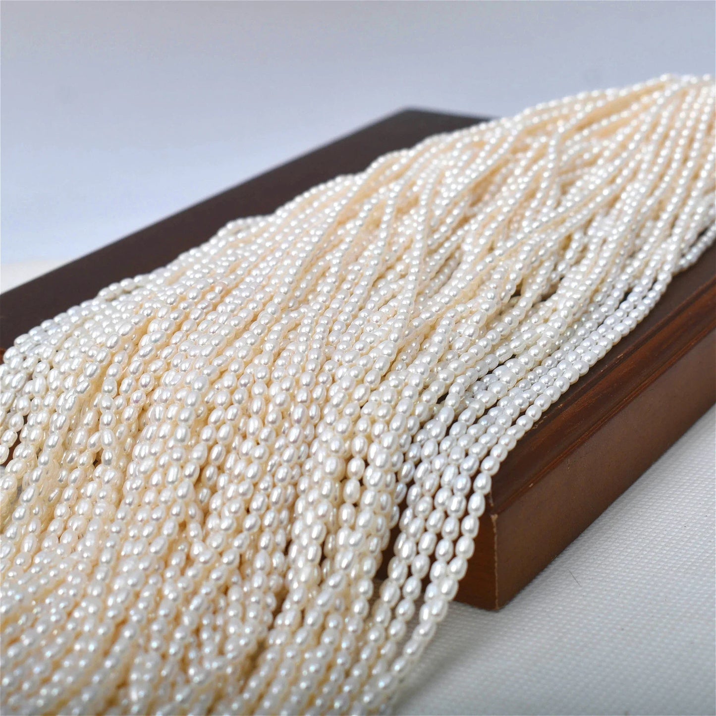 2.5-3mm Natural Radiant Freshwater White Rice AAAA Pearls Well-polished Smooth